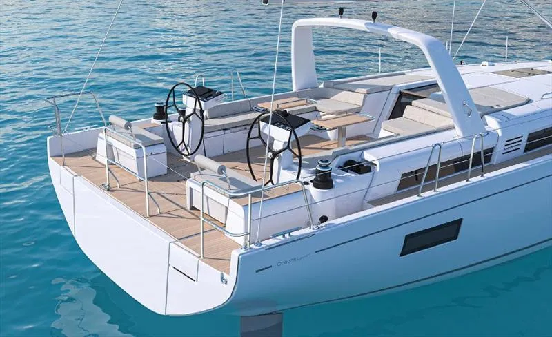 Slide: The Image of 2026 Beneteau Oceanis Yacht 60 sailing on clear blue water, showcasing elegant deck design. - 3