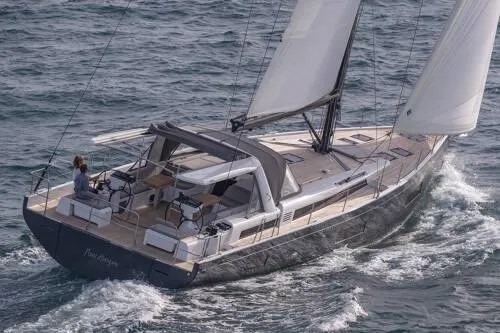 Slide: The Image of 2026 Beneteau Oceanis Yacht 60 sailing on open water, showcasing sleek design and spacious deck. - 5