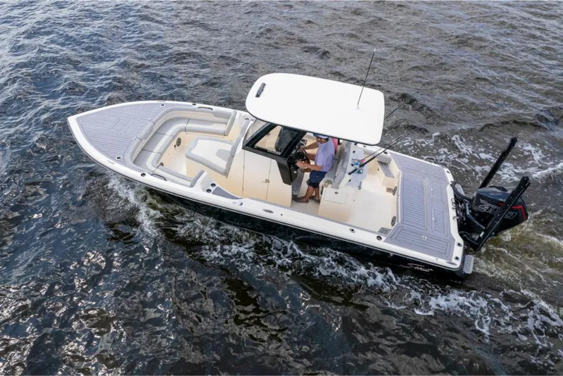 Slide: The Image of 2023 Scout 281 XSS boat cruising on water, top view. - 28