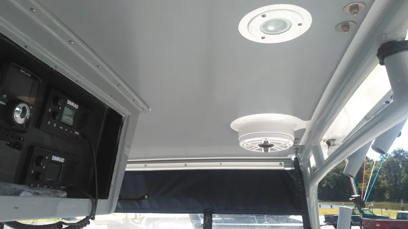 Slide: The Image of Interior view of 1986 Blackfin 27 Cuddy boat with electronic equipment and ceiling light. - 5