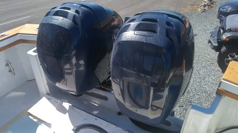 Slide: The Image of Twin outboard motors on a 1986 Blackfin 27 Cuddy boat. - 7