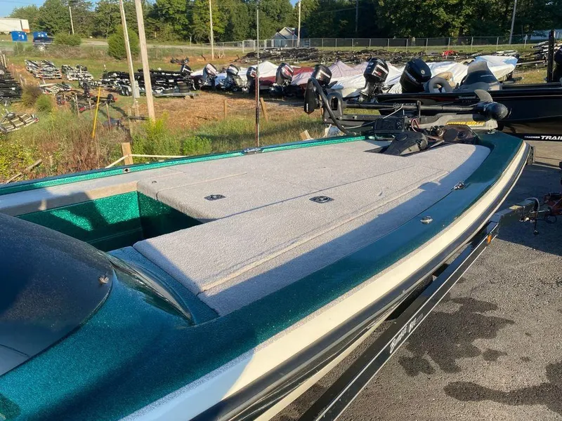 Slide: The Image of 2002 Bumble Bee 18 boat with spacious deck in outdoor setting. - 12