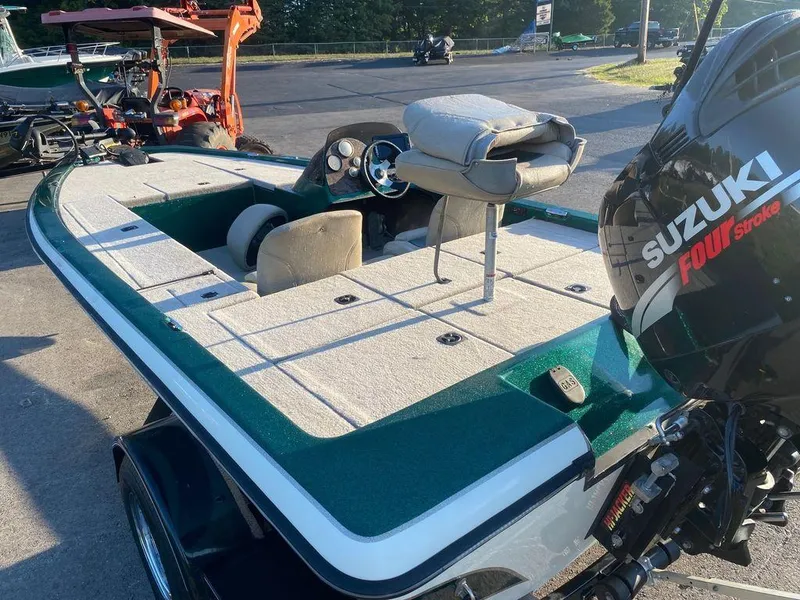 Slide: The Image of 2002 Bumble Bee 18 boat with Suzuki Four Stroke engine, parked outdoors. - 6