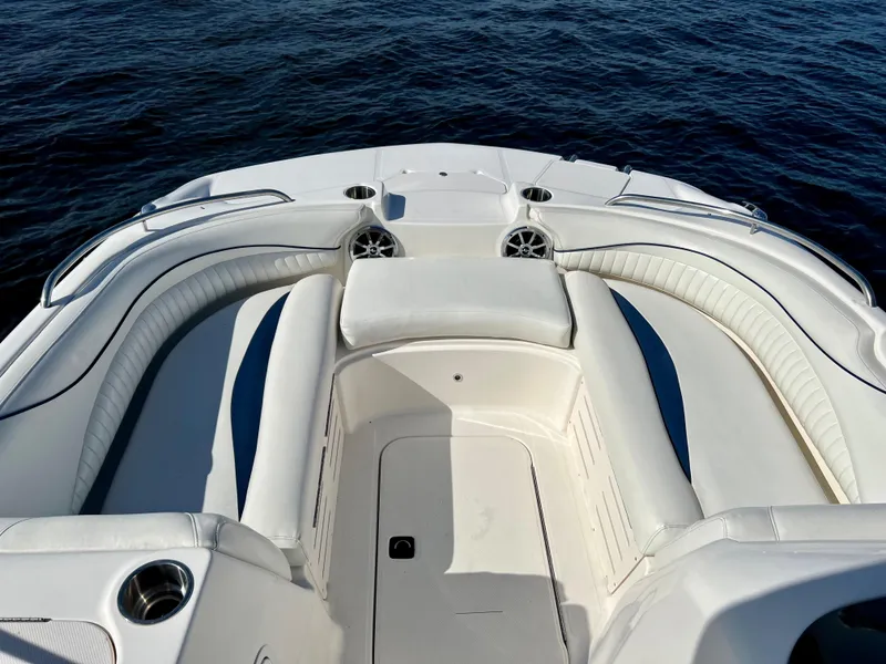 Slide: The Image of 2006 Hurricane 194 boat interior with white seating, on calm blue water. - 17