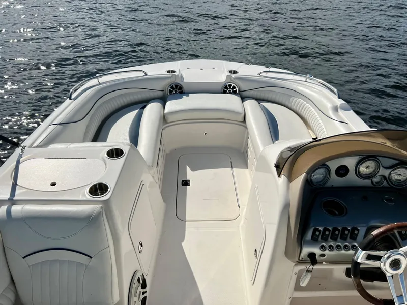 Slide: The Image of Hurricane 194 boat interior, 2006 model, with white seating and dashboard on water. - 23