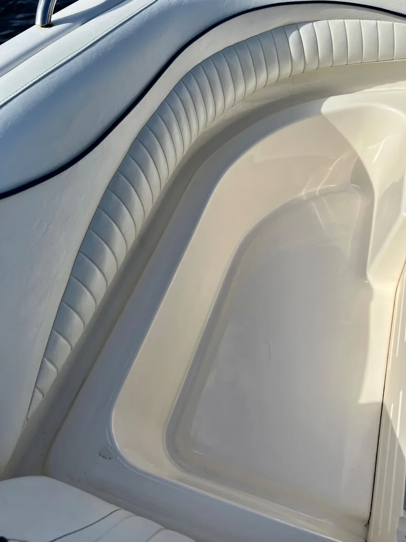 Slide: The Image of 2006 Hurricane 194 boat interior with white cushioned seating. - 32