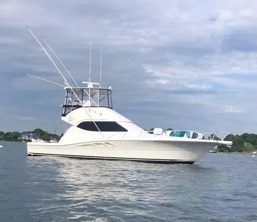 Slide: The Image of 2005 Rampage 45 Convertible Yacht on calm waters. - 14