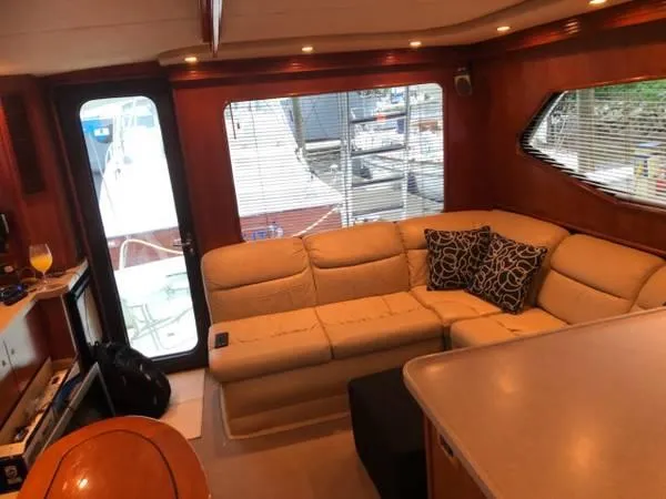 Slide: The Image of Interior of a 2005 Rampage 45 Convertible yacht with beige sofa. - 3