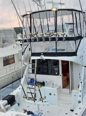 Slide: The Image of 2005 Rampage 45 Convertible yacht with fishing rods on deck. - 9