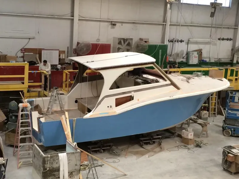 The Image of 2023 Albemarle 35 Express Coupe under construction in a workshop. - 0