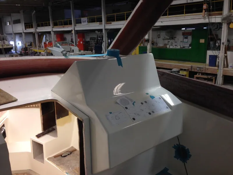 Slide: The Image of 2023 Albemarle 35 Express Coupe under construction in a boat manufacturing facility. - 4