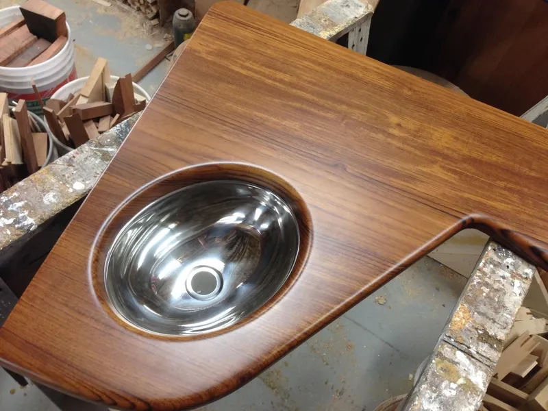 Slide: The Image of 2023 Albemarle 35 Express Coupe wooden countertop with stainless steel sink. - 5