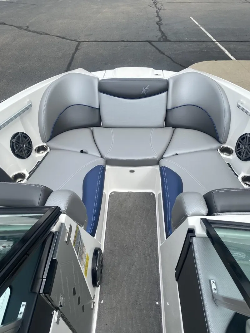 Slide: The Image of 2016 MasterCraft X23 boat interior with gray and blue seating. - 10