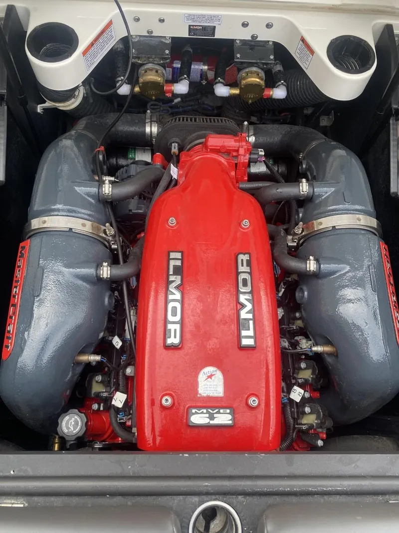 Slide: The Image of 2016 MasterCraft X23 Ilmor engine, red and gray components, detailed view. - 12
