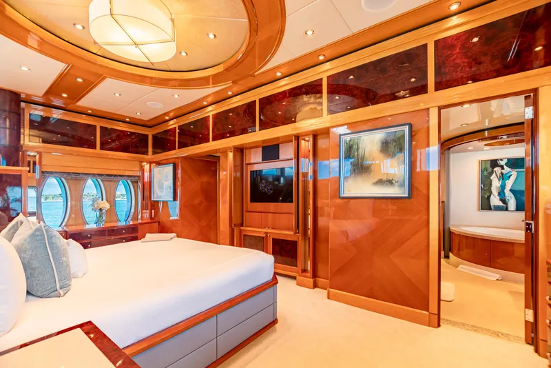 Slide: The Image of Luxurious bedroom interior of 2011 Trinity Yachts CUSTOM model with elegant wood finishes and modern decor. - 10