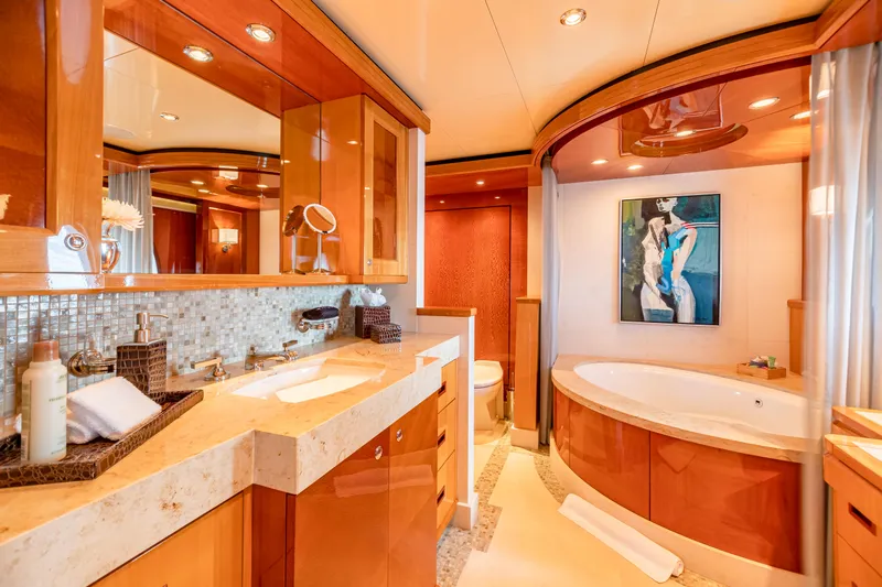 Slide: The Image of Luxurious bathroom on 2011 Trinity Yachts CUSTOM with modern fixtures and elegant wood finishes. - 12