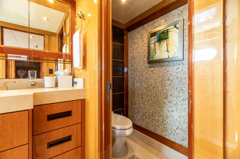 Slide: The Image of Luxurious bathroom on 2011 Trinity Yachts CUSTOM with modern fixtures and elegant wood finishes. - 17