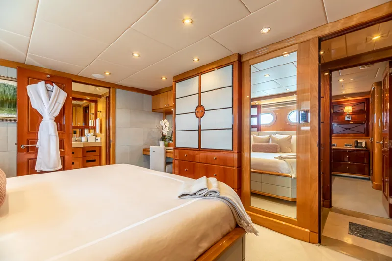 Slide: The Image of Luxurious bedroom interior of 2011 Trinity Yachts CUSTOM model with wooden accents and modern amenities. - 19