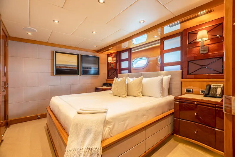 Slide: The Image of Luxurious bedroom on 2011 Trinity Yachts CUSTOM yacht with modern decor and cozy lighting. - 20