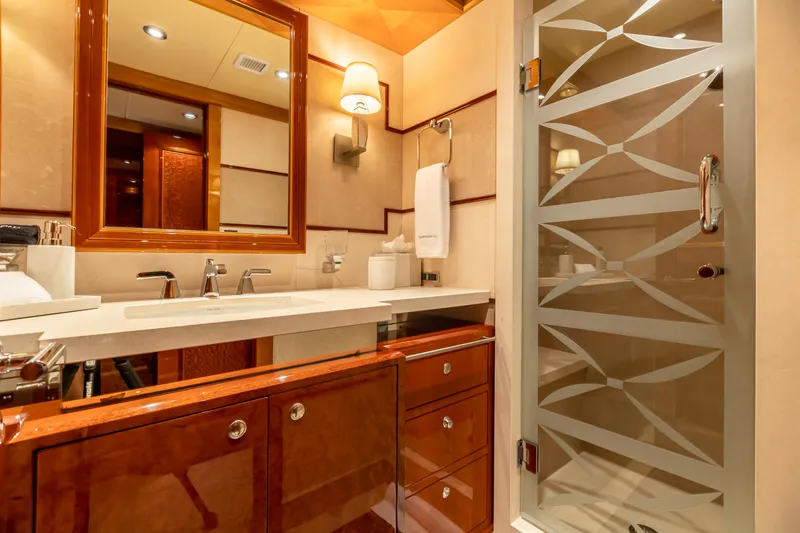 Slide: The Image of Luxurious bathroom on a 2011 Trinity Yachts CUSTOM yacht with elegant wood cabinetry. - 26