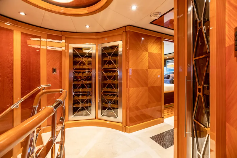 Slide: The Image of Luxurious interior of 2011 Trinity Yachts CUSTOM with elegant wood paneling and wine storage. - 27