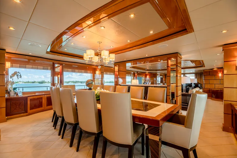 Slide: The Image of Luxurious dining area on 2011 Trinity Yachts CUSTOM model with elegant furnishings and panoramic windows. - 3