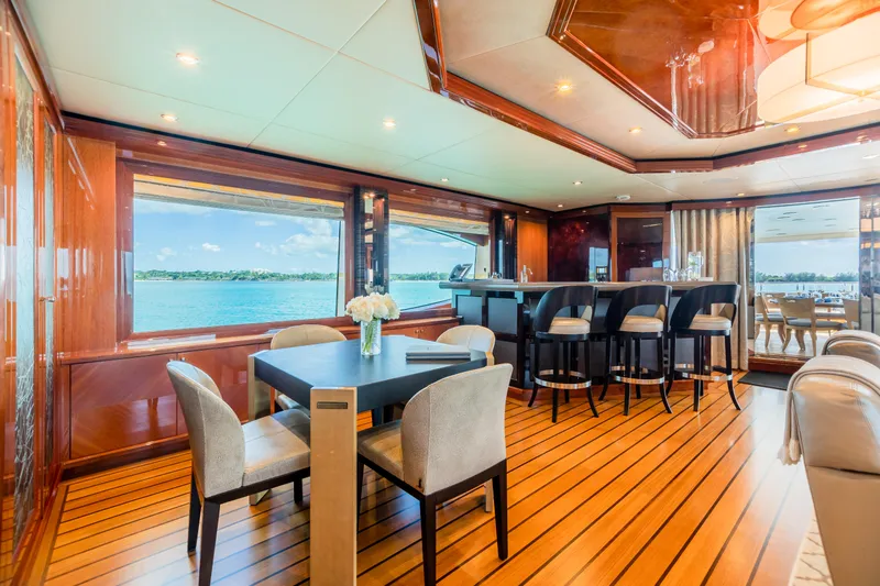 Slide: The Image of Luxurious interior of 2011 Trinity Yachts CUSTOM with dining area and bar, overlooking the ocean. - 30