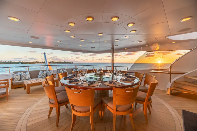 Slide: The Image of Luxury dining area on 2011 Trinity Yachts CUSTOM at sunset. - 36