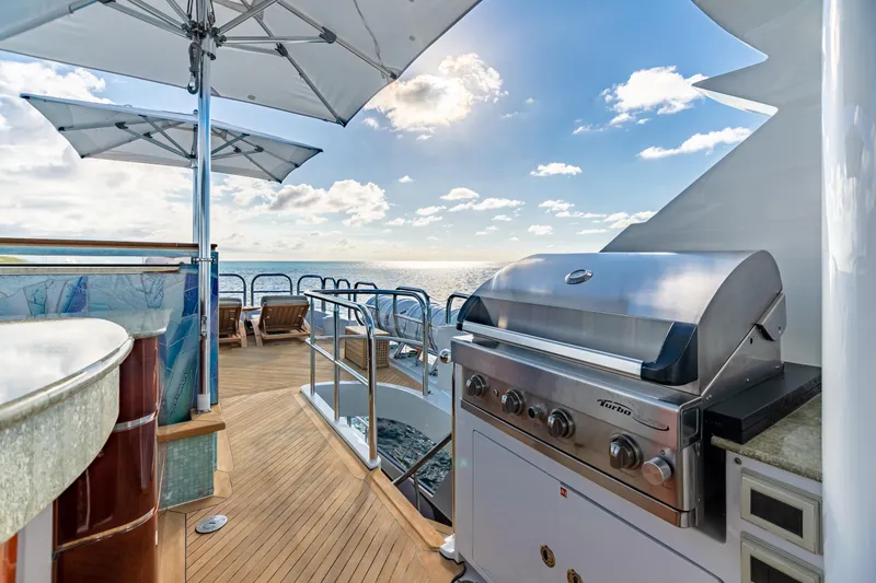 Slide: The Image of Luxury yacht deck with BBQ grill, ocean view, and seating area. Trinity Yachts CUSTOM 2011. - 39