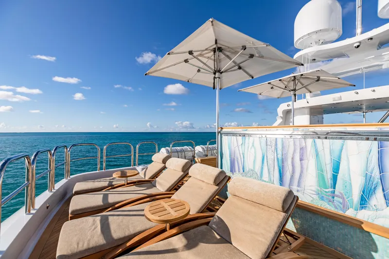 Slide: The Image of Luxury deck of 2011 Trinity Yachts CUSTOM with sun loungers and ocean view. - 40