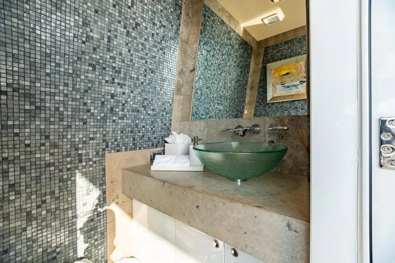Slide: The Image of Luxurious bathroom on 2011 Trinity Yachts CUSTOM with glass sink and mosaic tile wall. - 43