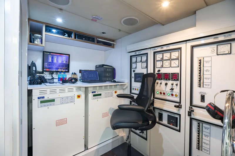 Slide: The Image of 2011 Trinity Yachts CUSTOM yacht control room with advanced monitoring systems and control panels. - 49