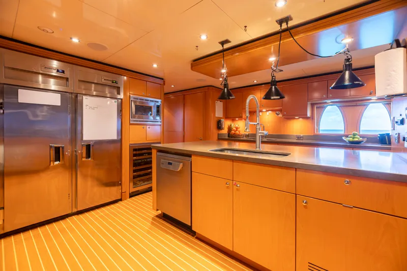 Slide: The Image of Luxurious kitchen on 2011 Trinity Yachts CUSTOM with stainless steel appliances and modern lighting. - 7