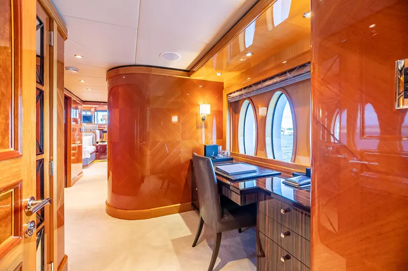Slide: The Image of Luxurious interior of 2011 Trinity Yachts CUSTOM with elegant wood finishes and a workspace. - 8