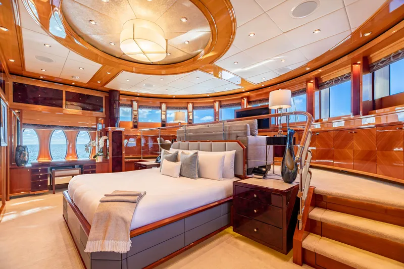 Slide: The Image of Luxurious master bedroom on 2011 Trinity Yachts CUSTOM yacht with elegant wood finishes. - 9
