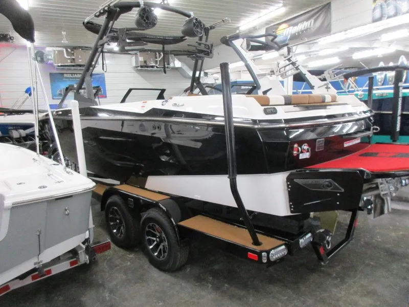 Slide: The Image of 2023 Axis A225 boat on trailer in showroom. - 10