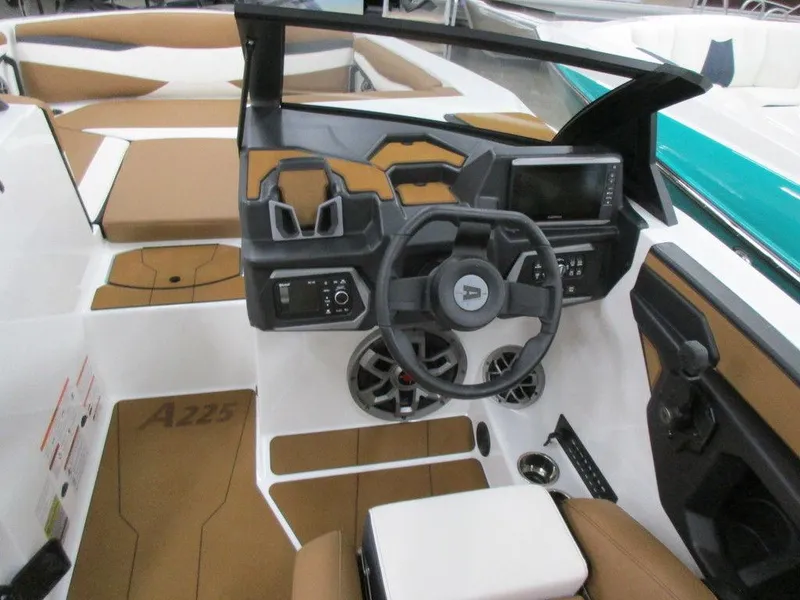 Slide: The Image of 2023 Axis A225 boat interior with steering wheel and control panel. - 7
