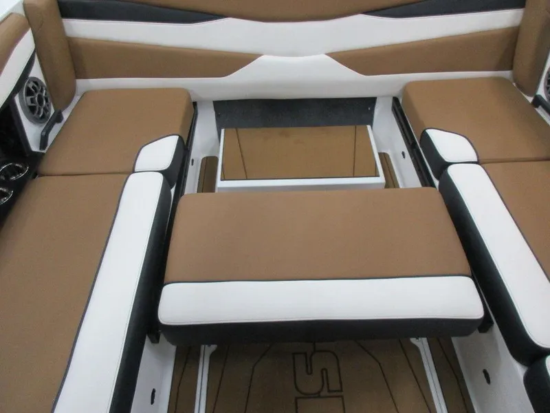 Slide: The Image of 2023 Axis A225 boat interior with brown and white cushioned seating. - 9
