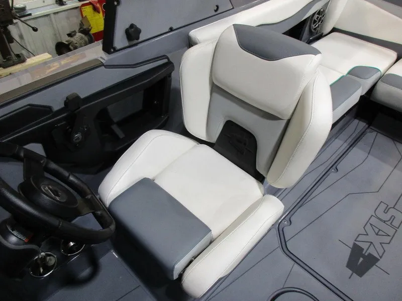 Slide: The Image of 2023 Axis T220 boat interior with white and gray captain's seat and steering wheel. - 14