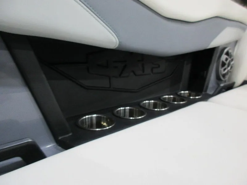 Slide: The Image of 2023 Axis T220 boat interior with cup holders and speaker. - 16
