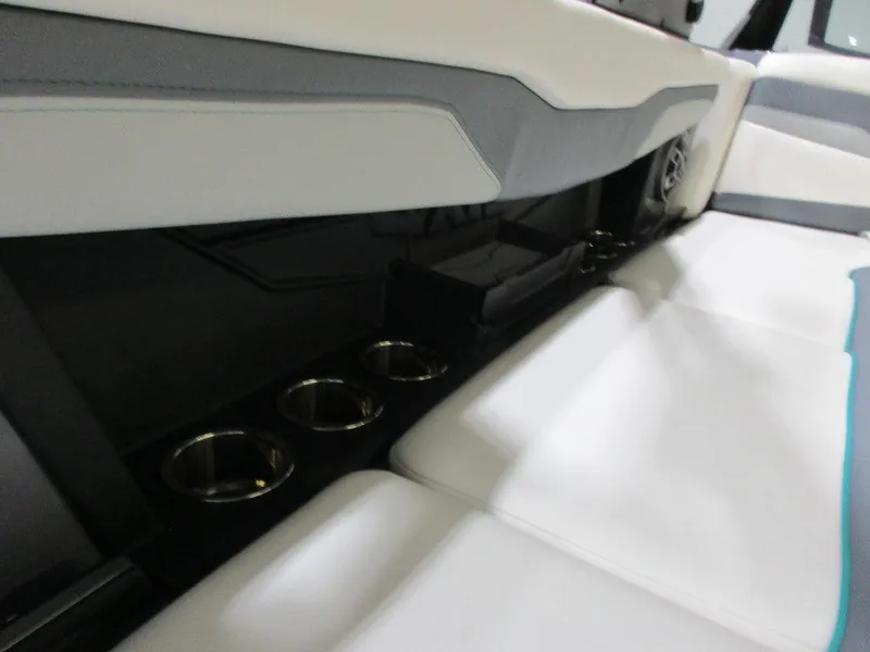 Slide: The Image of 2023 Axis T220 boat interior with white seats and cup holders. - 17