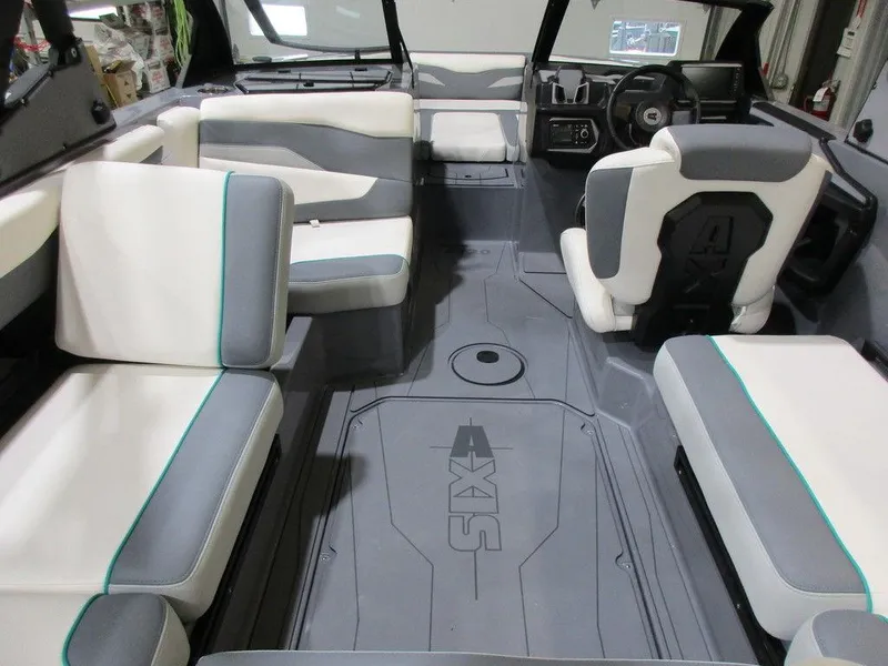 Slide: The Image of 2023 Axis T220 boat interior with gray and white seating. - 19
