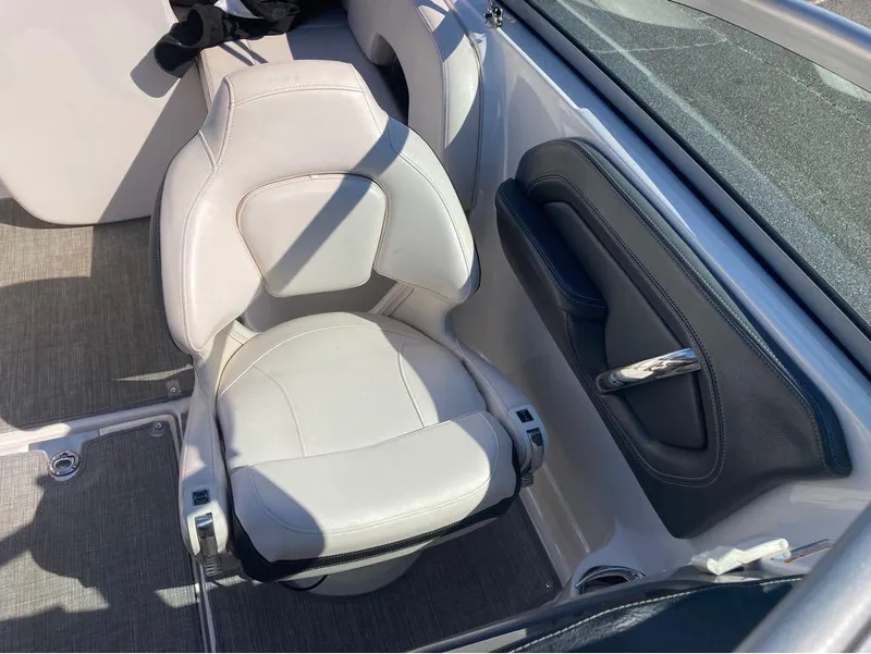 Slide: The Image of 2018 Chaparral 244 Sunesta boat interior with white seating and sleek design. - 6