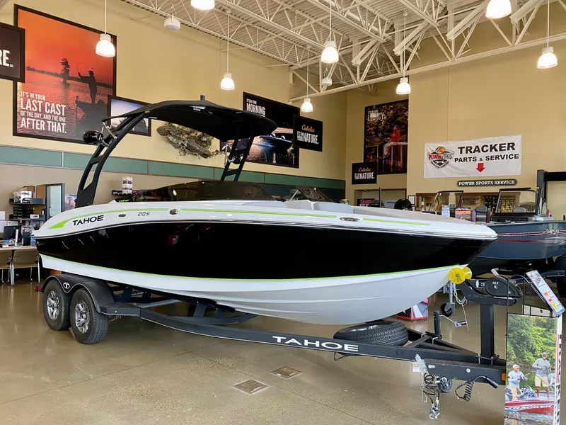 Slide: The Image of 2023 Tahoe 210 Si Limited boat on display in showroom. - 3