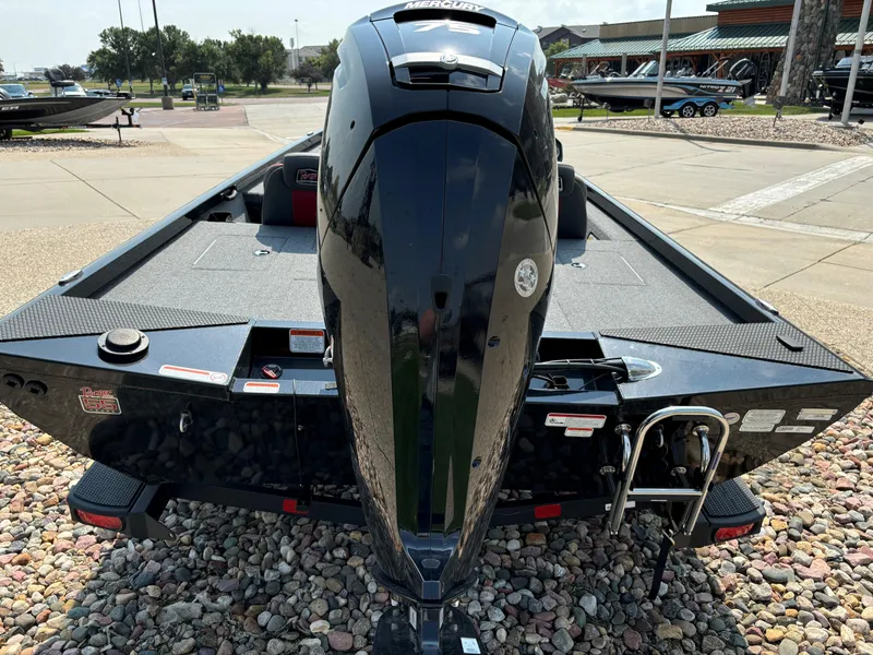 Slide: The Image of 2023 Ranger RT178 boat with powerful outboard motor, parked on gravel. - 3