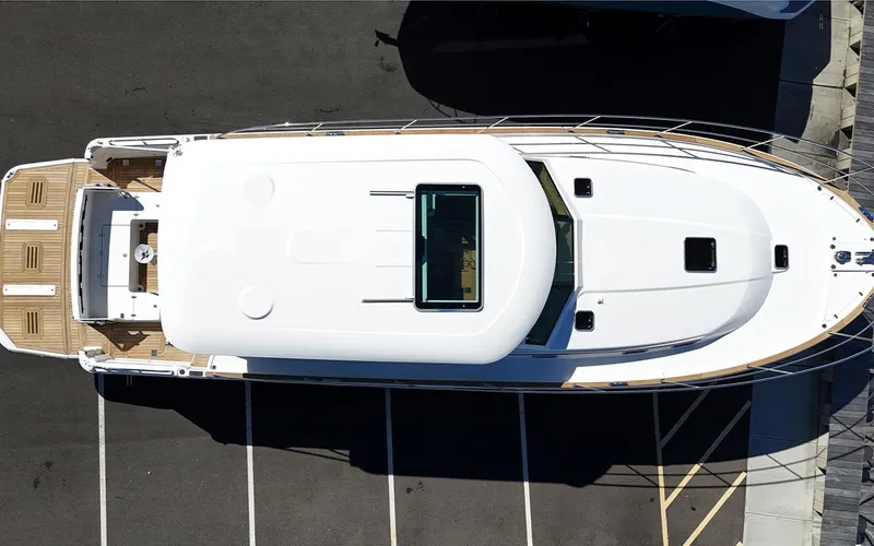 Slide: The Image of Top view of 2025 Sabre 45 Salon Express yacht in a parking area. - 11