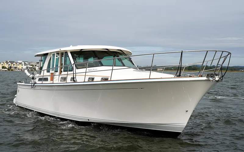 Slide: The Image of 2025 Sabre 45 Salon Express yacht cruising on open water. - 2