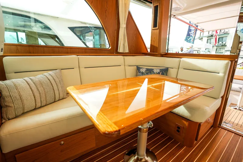 Slide: The Image of Luxurious interior of 2025 Sabre 45 Salon Express yacht with elegant seating and wooden table. - 21