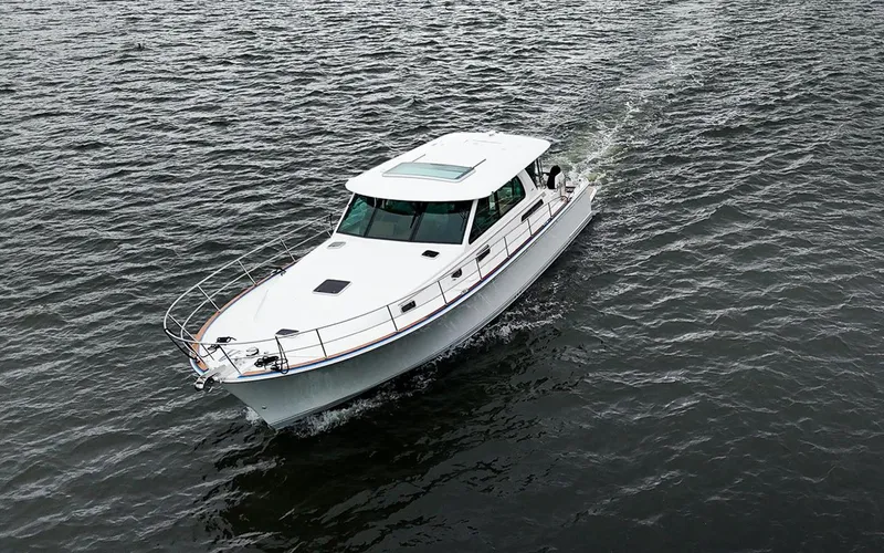 Slide: The Image of 2025 Sabre 45 Salon Express cruising on open water. - 4