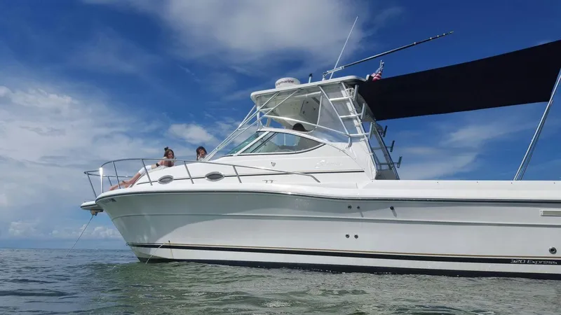 Slide: The Image of 2006 Stamas 320 Express boat on water under clear blue sky. - 10